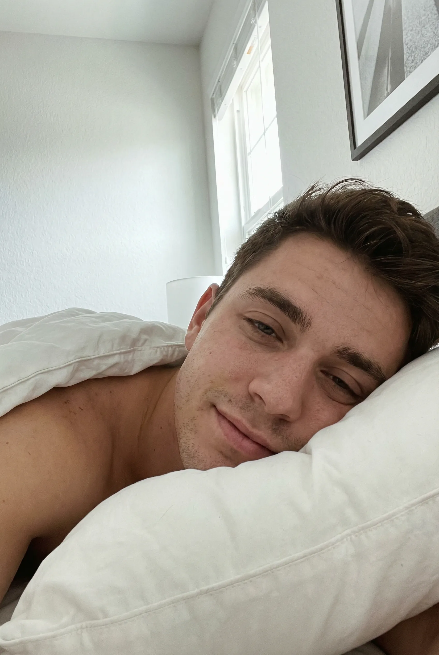 close up selfie shirtless sleepy pillow luxury