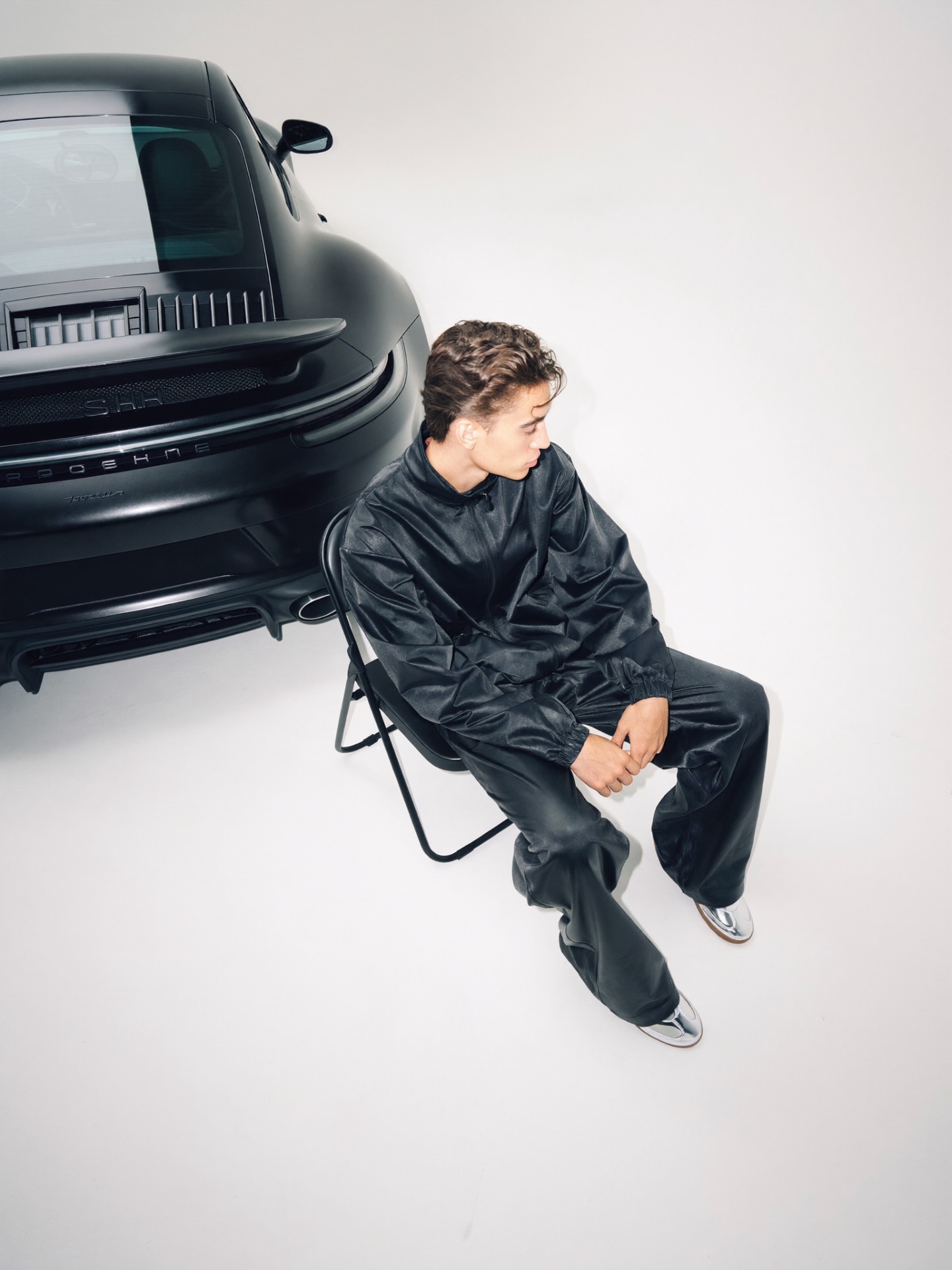 high angle black tracksuit Porsche 911 matte